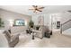Inviting living room featuring neutral tones, ceiling fan, and modern decor at 625 St Annes Pl, Covington, GA 30016