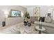 Cozy living room showcasing a stylish rug, comfortable seating, and contemporary accents at 625 St Annes Pl, Covington, GA 30016
