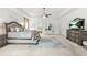 This main bedroom features a ceiling fan, dresser, and decor at 625 St Annes Pl, Covington, GA 30016