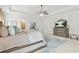 This main bedroom features a ceiling fan, dresser, and decor at 625 St Annes Pl, Covington, GA 30016