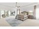 This main bedroom features a ceiling fan, decorative rug, and sitting area with fireplace at 625 St Annes Pl, Covington, GA 30016