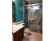 Modern bathroom with walk-in shower, tiled surround, and vanity with sink at 1034 Bettina Sw Ct, Mableton, GA 30126