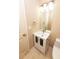 Small and complete bathroom with a white vanity and toilet at 7030 Wessex Way, Cumming, GA 30028