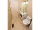 Compact bathroom with vanity, toilet, and a door at 7030 Wessex Way, Cumming, GA 30028