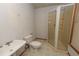 Standard bathroom featuring a sink, toilet, and stand-up shower at 7030 Wessex Way, Cumming, GA 30028