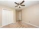 Carpeted bedroom with ceiling fan and closet at 7030 Wessex Way, Cumming, GA 30028