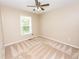 Neutral bedroom with carpet, ceiling fan and single window at 7030 Wessex Way, Cumming, GA 30028