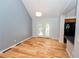 Bright dining area features hardwood floors and double doors leading to an outdoor deck at 7030 Wessex Way, Cumming, GA 30028