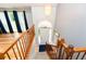 Elegant foyer view from above features hardwood floors, natural light, and staircase at 7030 Wessex Way, Cumming, GA 30028