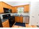 Well-equipped kitchen featuring modern appliances, granite countertops, and efficient layout at 7030 Wessex Way, Cumming, GA 30028