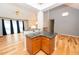 Stylish kitchenette area with granite countertops, pendant lighting, and seamless flow to the living space at 7030 Wessex Way, Cumming, GA 30028