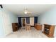 Cozy living area features a vintage piano, wet bar, fireplace, and a ceiling fan for added comfort at 7030 Wessex Way, Cumming, GA 30028