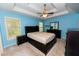 Comfortable and well-lit main bedroom with large bed and matching furniture at 7030 Wessex Way, Cumming, GA 30028
