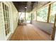 Enclosed wooden deck offering a screened-in space at 7030 Wessex Way, Cumming, GA 30028