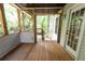 Enclosed deck with open doorway to backyard at 7030 Wessex Way, Cumming, GA 30028