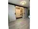 Bathroom with sliding barn doors, a shower curtain, toilet and wooden cabinets at 1929 Hazelwood Se Dr, Marietta, GA 30067