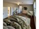 Spacious bedroom featuring a floral comforter, a lounge chair, and a modern wooden dresser at 1929 Hazelwood Se Dr, Marietta, GA 30067