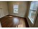 Neutral-toned bedroom with hardwood floors and a sunlit window at 1929 Hazelwood Se Dr, Marietta, GA 30067