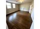 An empty bedroom with hardwood floors, ceiling fan, and two windows at 1929 Hazelwood Se Dr, Marietta, GA 30067