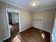 Bedroom featuring wood-paneled walls and hardwood floors at 1929 Hazelwood Se Dr, Marietta, GA 30067
