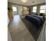 Modern bedroom with wood-look tile floors, ensuite access, and large window views at 1929 Hazelwood Se Dr, Marietta, GA 30067