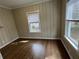 Cozy bedroom featuring hardwood floors, neutral paint, and natural light at 1929 Hazelwood Se Dr, Marietta, GA 30067