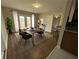 Charming dining room featuring a wood table, sleek chairs, and natural light from French doors at 1929 Hazelwood Se Dr, Marietta, GA 30067