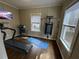 Well-equipped exercise room with hardwood floors, natural light and exercise equipment at 1929 Hazelwood Se Dr, Marietta, GA 30067