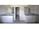 Bathroom with double sinks, granite countertops, and modern mirrors at 2504 Bear Mountain St, Lithonia, GA 30058