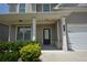 A lovely covered front porch highlights the facade of this inviting two-story home at 2504 Bear Mountain St, Lithonia, GA 30058