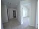 Bright, carpeted hallway with a large bedroom straight ahead and bonus room to the left at 2504 Bear Mountain St, Lithonia, GA 30058