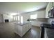 Kitchen featuring an open floor plan that connects to the living room at 2504 Bear Mountain St, Lithonia, GA 30058