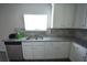 Close up of the sink area in the kitchen showing granite countertops at 2504 Bear Mountain St, Lithonia, GA 30058
