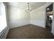 Inviting living room enhanced by hardwood floors, elegant crown molding, and large window at 2504 Bear Mountain St, Lithonia, GA 30058