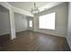 An inviting living area featuring hardwood floors, abundant natural light, and elegant wall moldings at 2504 Bear Mountain St, Lithonia, GA 30058