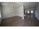 A spacious and bright living room featuring hardwood floors, crown molding, and natural light at 2504 Bear Mountain St, Lithonia, GA 30058