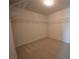 Walk-in closet with carpeting and metal shelving for organizing clothes and accessories at 2504 Bear Mountain St, Lithonia, GA 30058