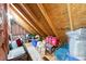 Attic space with exposed beams, storage bins, and ample room for storage at 312 Laurel Run Cv, Sugar Hill, GA 30518