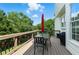 Outdoor deck with dining furniture, grill, and views of the landscaped backyard at 312 Laurel Run Cv, Sugar Hill, GA 30518