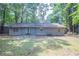 Backyard featuring a patio and view of trees at 4116 Wendell Way, Snellville, GA 30039