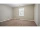 Bedroom featuring neutral walls and carpet, window and closet at 4116 Wendell Way, Snellville, GA 30039