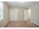 Bedroom featuring neutral walls and carpet, window and closet at 4116 Wendell Way, Snellville, GA 30039