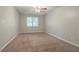 Bedroom featuring neutral walls and carpet, ceiling fan, and window at 4116 Wendell Way, Snellville, GA 30039