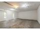 Garage featuring concrete floors, white walls, and a ceiling with can lights at 4116 Wendell Way, Snellville, GA 30039