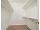Walk-in closet featuring carpeted floors and built in shelving at 4116 Wendell Way, Snellville, GA 30039