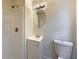 Bathroom featuring a shower, vanity with sink, and a mirror at 8272 Magnolia Dr, Jonesboro, GA 30238