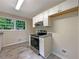 Updated kitchen featuring stainless steel appliances, granite countertops, and tile flooring at 8272 Magnolia Dr, Jonesboro, GA 30238