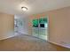 Cozy living room with a sliding glass door to the back deck overlooking the backyard at 8272 Magnolia Dr, Jonesboro, GA 30238