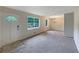 Spacious living room with large windows and neutral colors at 8272 Magnolia Dr, Jonesboro, GA 30238