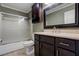 Bathroom featuring a vanity, a toilet, and a shower with glass doors at 1840 Linwood Ave, Atlanta, GA 30344